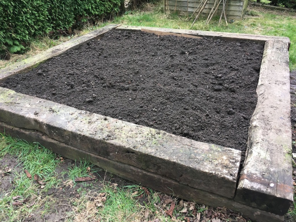 Empty raised bed in sleepers