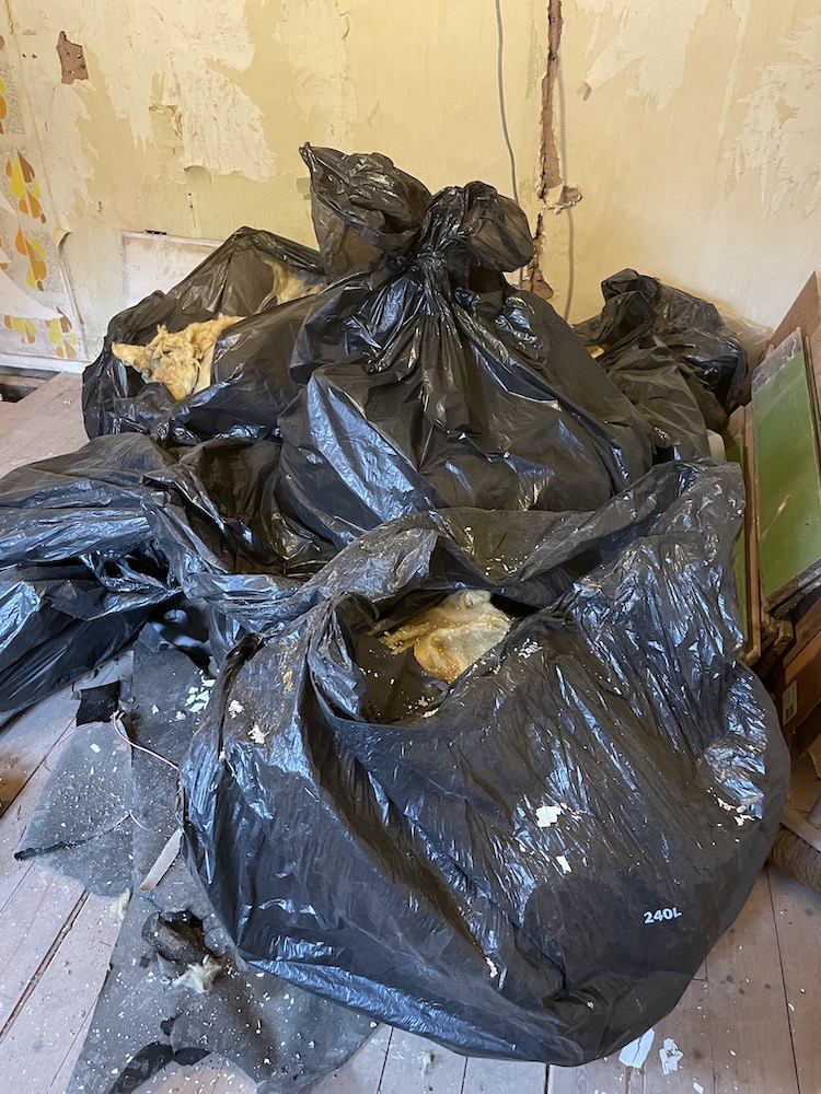 Black bin bags full of old insulation